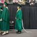 Huron's last graduate Zibo Zou, wearing the ceremonial rat's tail, waits next in line to receive his diploma, Wednesday, June 5.
Courtney Sacco I AnnArbor.com 
 
